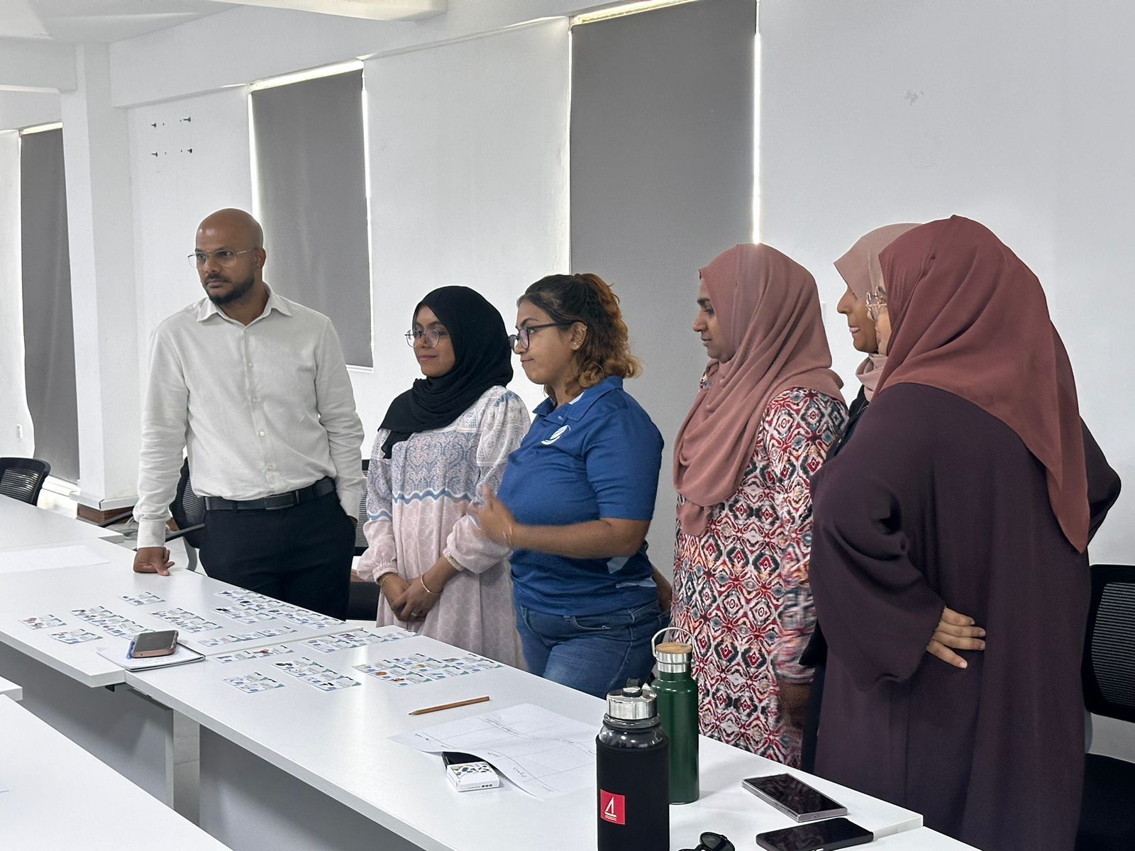 Ministry staff reviewing sorted cards