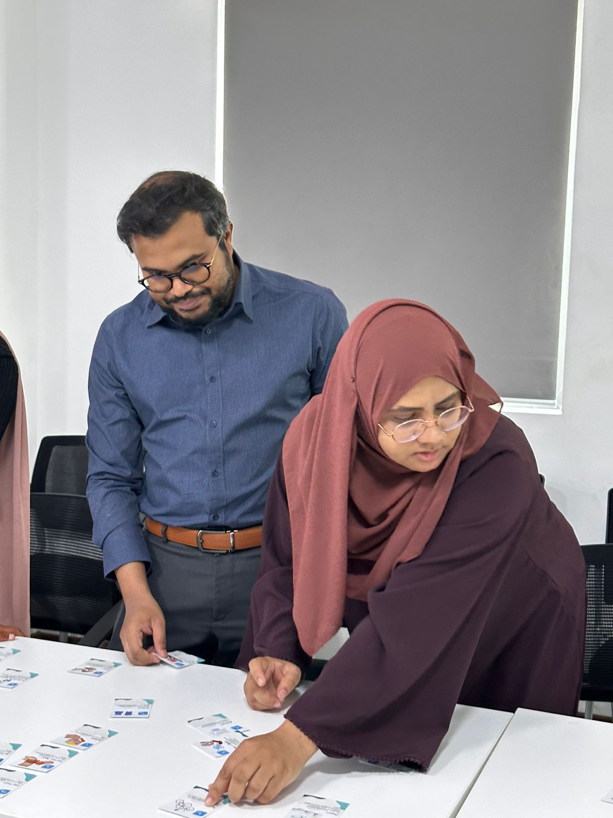 Ministry staff placing cards during the orientation